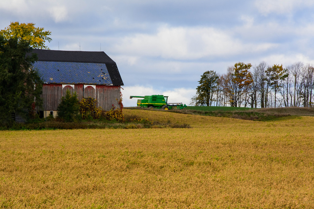 tractor-rolling-by-farm